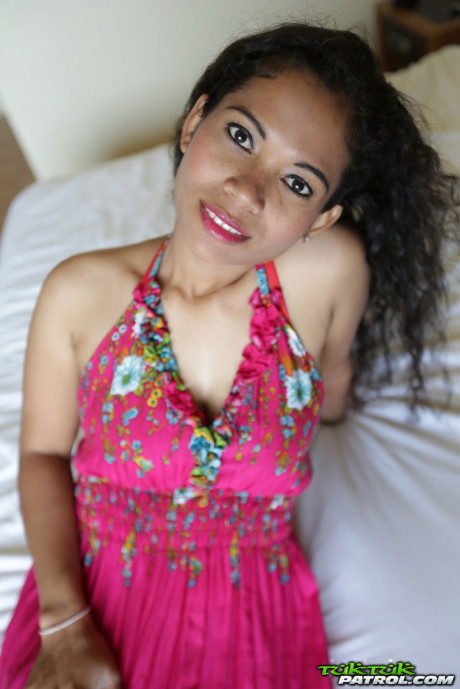 Curly-haired Thai babe Nees shows her pretty boobies & her bald vagina