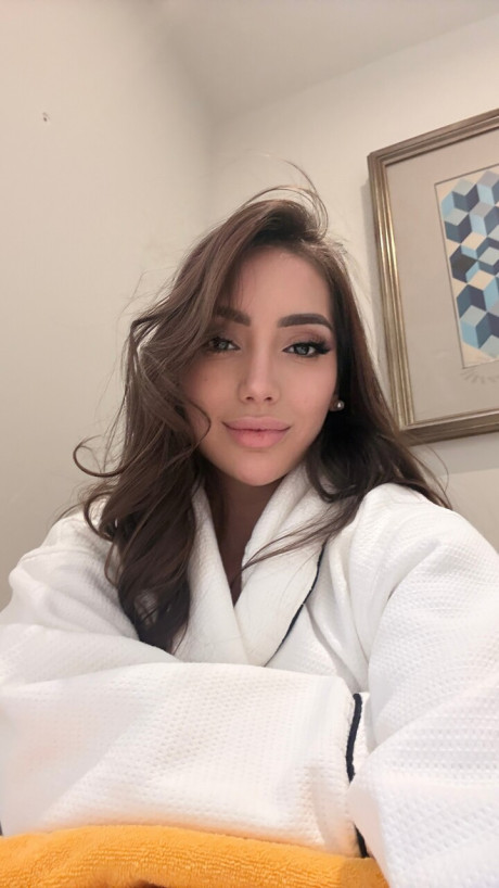 Solo model Haleema Ahmed takes a bunch of self shots while fully clothed