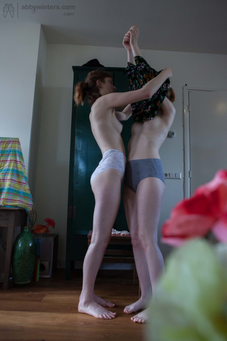 Amateur hotties Emma B & Sondrine show their silky pussies while dressing