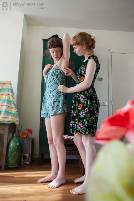 Amateur hotties Emma B & Sondrine show their silky pussies while dressing