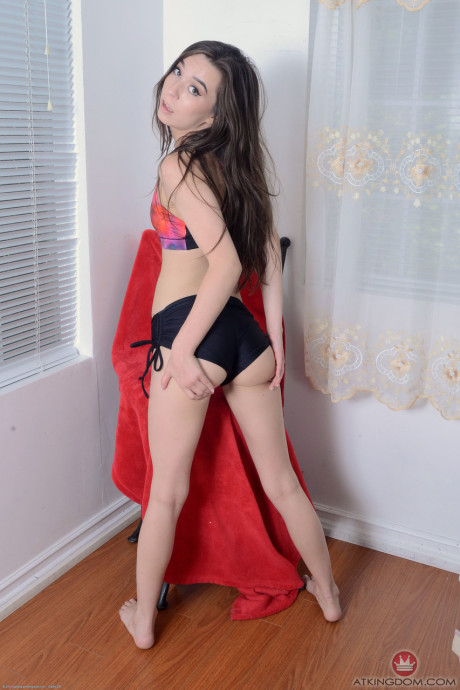 Raven-haired teenie Ariel Grace displays her trimmed twat & shaved butthole