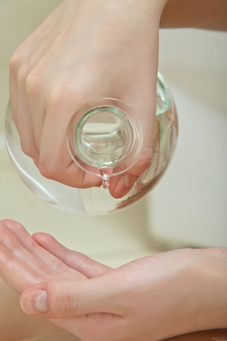 Teenie babe Sabina B oils up her puffy nipples & her pretty body in the bathroom