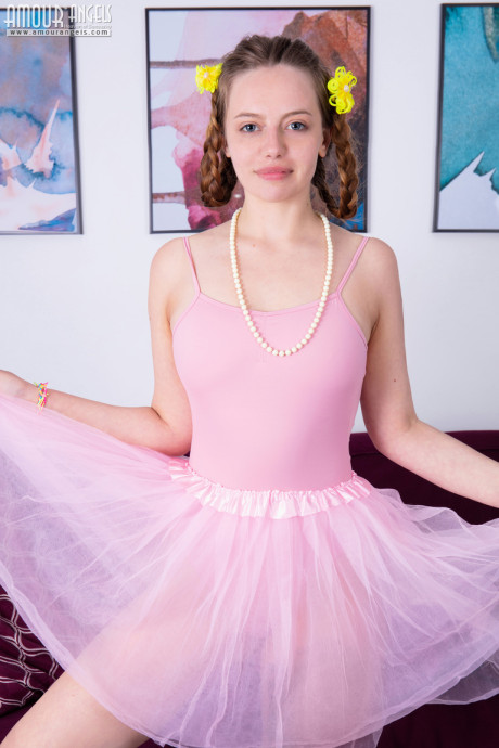 Fresh young ballerina Sissy sets her great body free of clothing upon a sofa