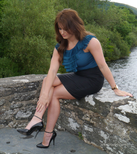 Non undressed model Penny poses outside to show off her super hot legs and ankles