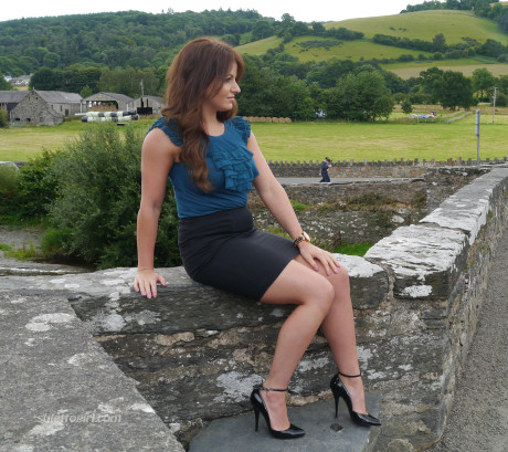Non undressed model Penny poses outside to show off her super hot legs and ankles