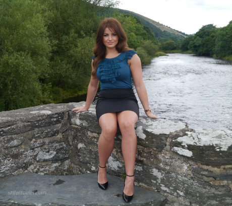 Non undressed model Penny poses outside to show off her super hot legs and ankles