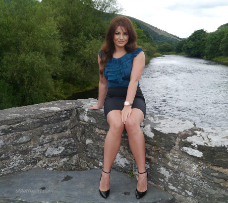 Non undressed model Penny poses outside to show off her super hot legs and ankles