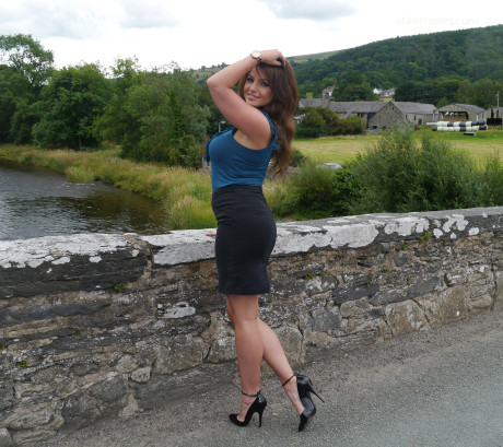 Non undressed model Penny poses outside to show off her super hot legs and ankles