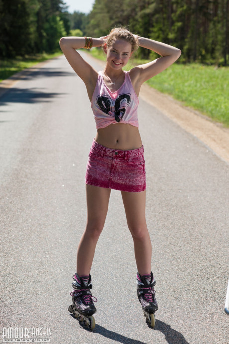 Fresh teen yellow-haired slut gf girl Faina gets undressed in middle of road wearing roller blades