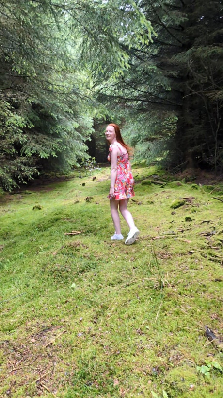 OnlyFans teen ginger head Shannen strips in the forest and shows her big ass