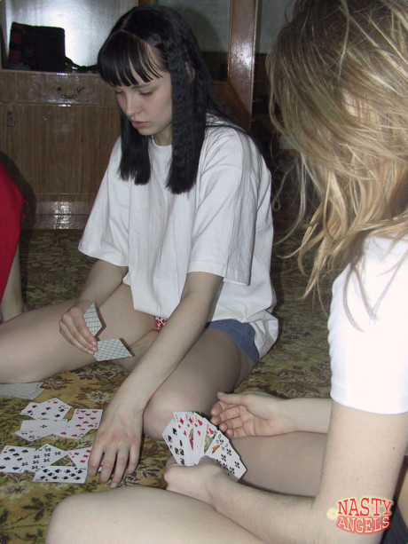 Wild amateur teens strip nude while playing cards on the carpet