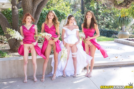 Lesbian girls in bridesmaids uniform flash hot behind in naked upskirt in the park