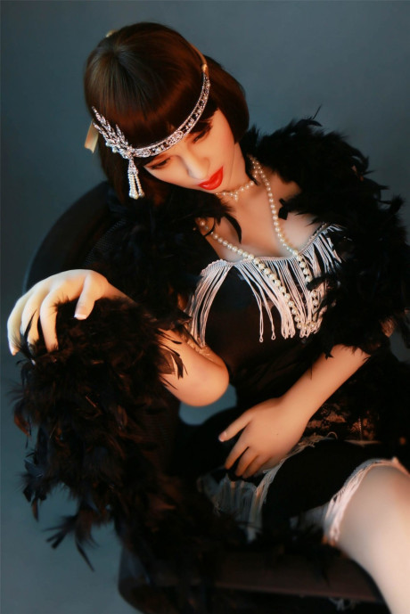 Dark haired flapper sex doll Prudence flaunts her large nipples and big juggs