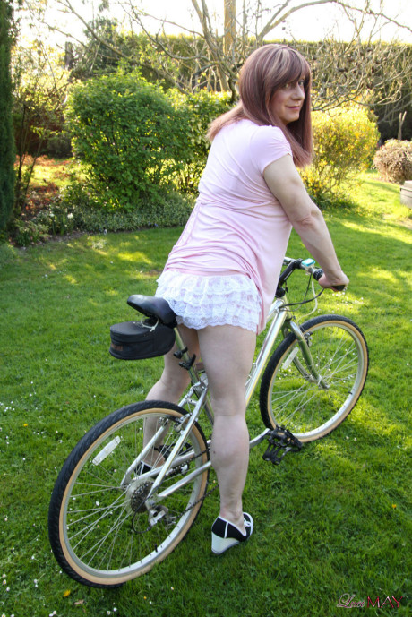 Redheaded trans broad pulls out her cock while riding a bicycle