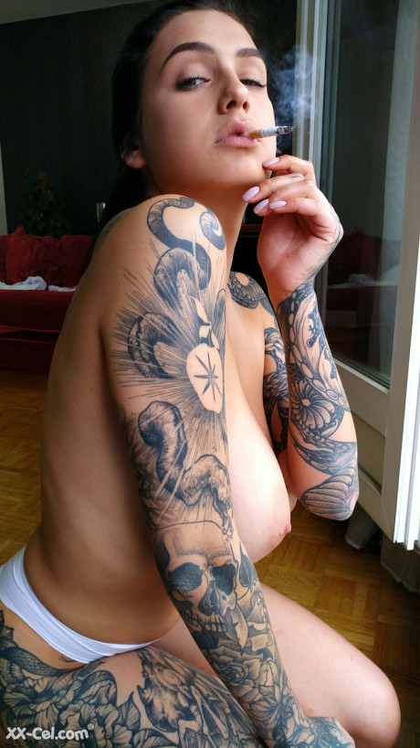 Amateur babe Evgenia Talanina showing off her cute tattoos & enormous tits