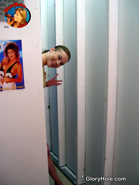 Smoking hot young Brooklyn Nights mounts a long dark dick through a gloryhole
