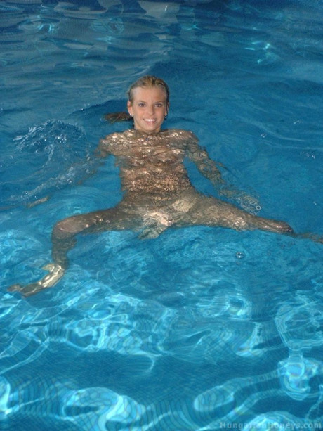 Pretty blondy young Lilu plays nude in the pool before posing with two studs