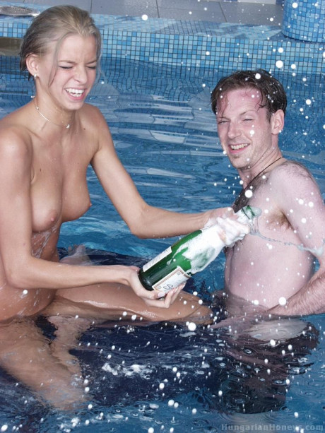 Pretty blondy young Lilu plays nude in the pool before posing with two studs