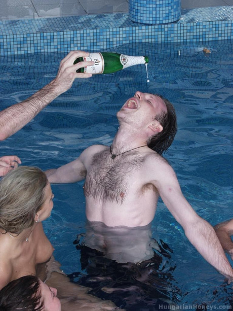 Pretty blondy young Lilu plays nude in the pool before posing with two studs