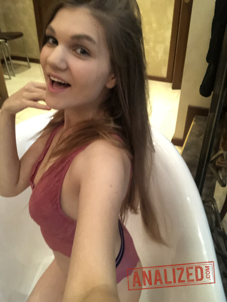 Amateur bitch gf woman flashes her tits while taking self shots in a bathroom