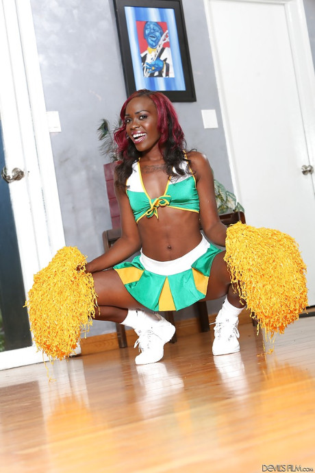 Black cheerleader Bella Doll is dancing nude on the camera