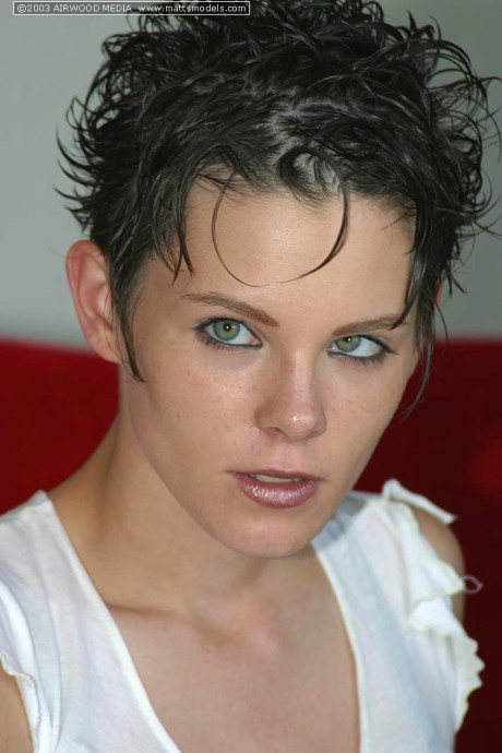 First timer with spiky short hair reveals big naturals as she strips nude