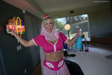 Pretty blonde housewife releases her hooters from Jeanie outfit