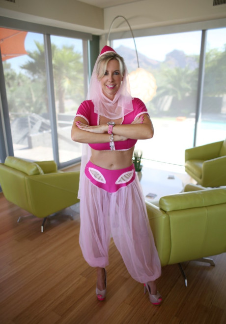 Pretty blonde housewife releases her hooters from Jeanie outfit