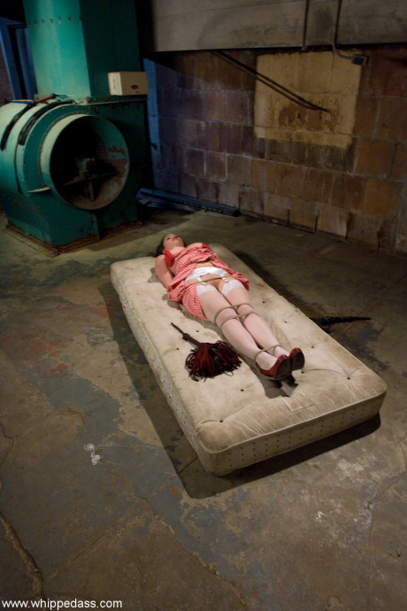 Redheaded lezdom Claire Adams restrains Charlotte Vale and toys her snatch