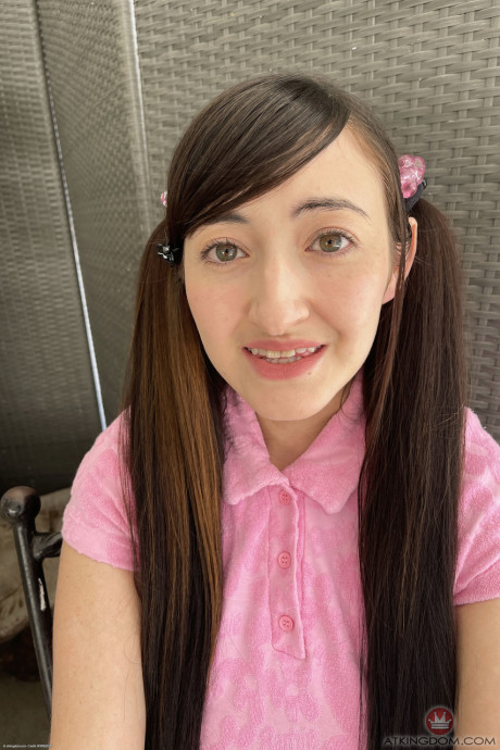 Brunette teen with pigtails Tifa Quinn displays her large boobs and hot booty