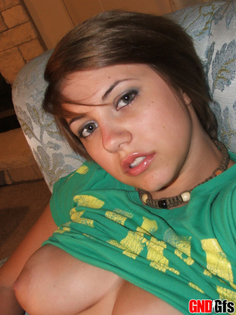 Fresh young looking amateur takes self shots of her enormous natural tits