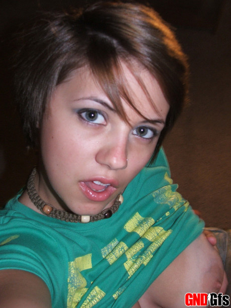 Fresh young looking amateur takes self shots of her enormous natural tits