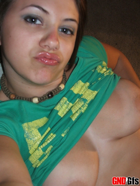 Fresh young looking amateur takes self shots of her enormous natural tits