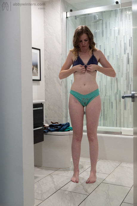 Amateur Australian model Paisley showing her lean body in the bathroom