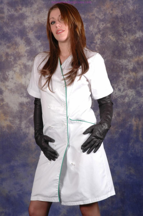 Hot nurse Sophie exposes her stocking tops in long ebony leather gloves