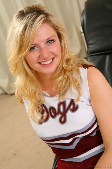 Charming cheerleader Jessica N loses her uniform to pose in her sheer stockings