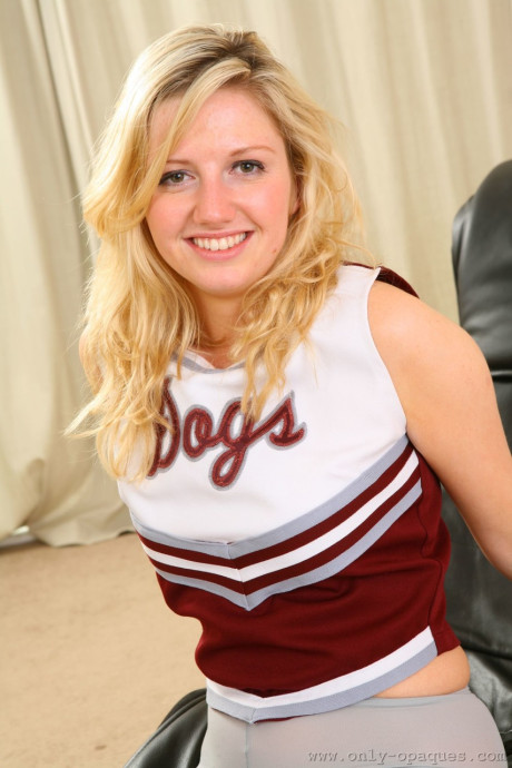 Charming cheerleader Jessica N loses her uniform to pose in her sheer stockings