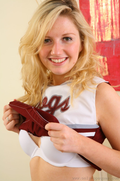 Charming cheerleader Jessica N loses her uniform to pose in her sheer stockings