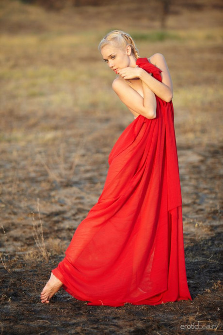Hot blondie teenie Aljena A works clear of a red gown out on the barrens