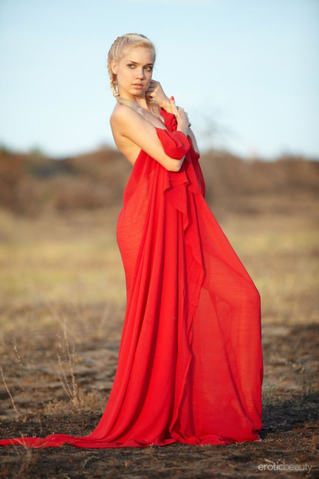 Hot blondie teenie Aljena A works clear of a red gown out on the barrens