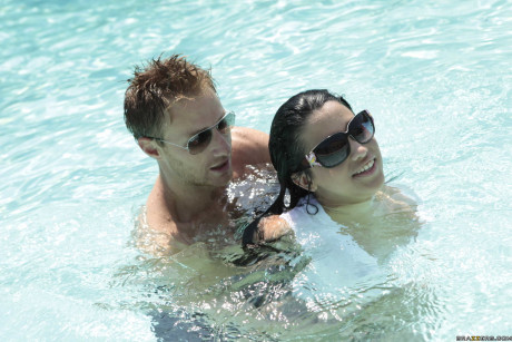 Adorable busty babe with fake tits Abella Anderson gives her muff by the pool