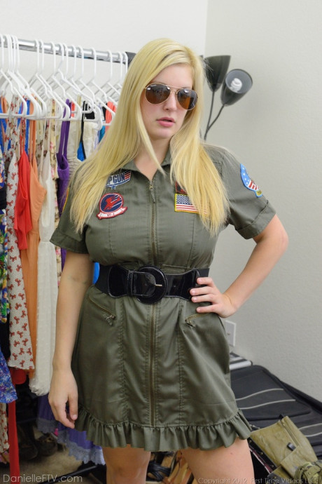 Busty blondy Danielle flashes her enormous boobs and bald twat in the uniform shop