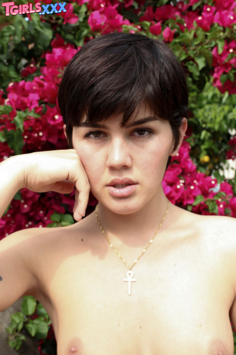 Short-haired tgirl amateur Daisy Taylor exposes her hot behind and giant dick