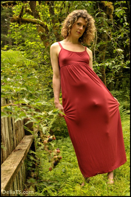 Gorgeous cute tgirl hard penis bulges obscenely under long, clinging dress