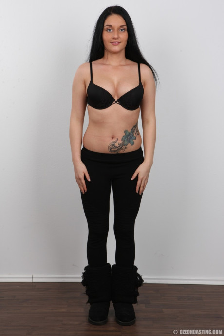 Black haired amateur Lucie shows her tattoo and tits to land a porn gig
