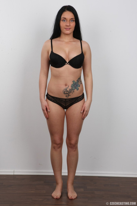 Black haired amateur Lucie shows her tattoo and tits to land a porn gig