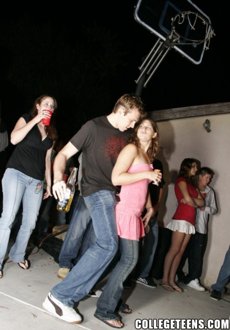 Two amateur babes lick giant rods and get rammed during a pretty party