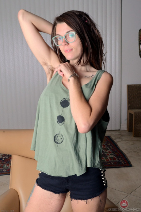 Nerdy brunette Valkyree Jaine spreading her very hairy twat wide open