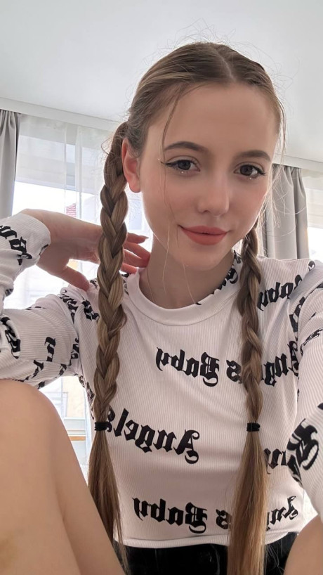 Pretty blonde young Katya Sun takes numerous self shots in SFW mode