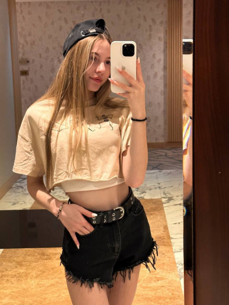 Pretty blonde young Katya Sun takes numerous self shots in SFW mode